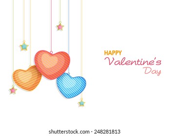Happy Valentine's Day celebration greeting card decorated by colorful glossy hanging hearts and stars on white background.