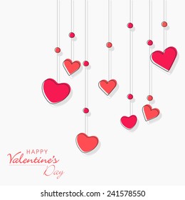 Happy Valentine's Day celebration love greeting card design with hanging pink love hearts on white background.