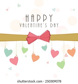 Happy Valentines Day celebration love greeting card with colorful hearts hanging by ribbon.