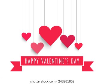 Happy Valentine's Day celebration with pink hanging hearts and ribbon on white background.