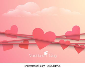 Happy Valentine's Day celebration with pink hearts on colorful cloudy background.