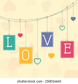Happy Valentine's Day celebration with text Love on colorful frames and hearts hanging by rope.