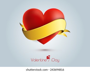 Happy Valentine's Day celebrations with red heart gift wrapped by golden ribbon on blue background.