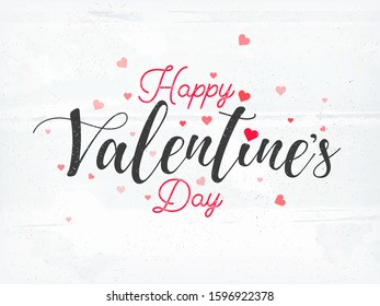 Happy Valentine's Day Font Decorated with Tiny Hearts on White Texture Background.