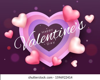 Happy Valentine's Day Font Decorated with Glossy Pink Hearts on Paper Layer Cut Hearts and Purple Bokeh Background.