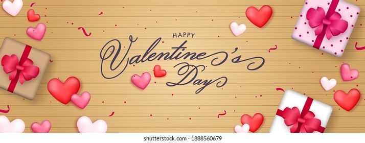 Happy Valentine's Day Font With Top View Of 3D Gift Boxes And Hearts On Golden Wooden Background.