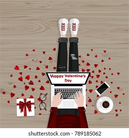 Happy Valentine's Day. Freelancer sitting on a floor and typing on laptop. Mobile phone, cup of coffee and gift box. Flat style vector illustration. Freelance concept.