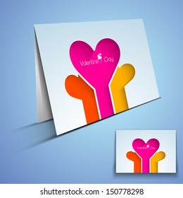 Happy Valentines Day greeting card or gift card with colorful hearts on blue background. 