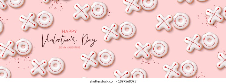 Happy Valentine's Day holiday banner. Holiday background with realistic XO cookies and red confetti on pink background. Vector illustration with 3d decorative objects for Valentine's Day.