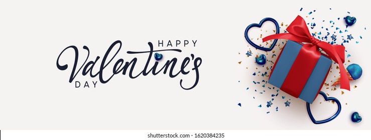 Happy Valentine's Day. Horizontal banner, header template for the website. Romantic realistic design elements, gift box, metal hearts strewn with sparkles confetti. Handwritten calligraphy lettering.