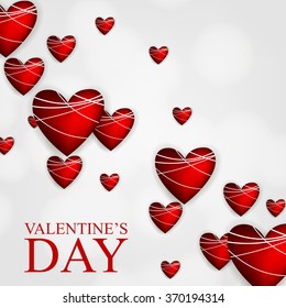 Happy Valentine's day lettering card with red flying hearts.