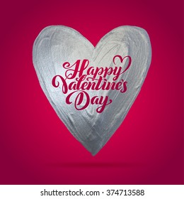 Happy Valentine's Day! Metal Silver Foil Heart on a Red Background with the calligraphic Inscription Inside.