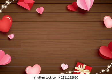 Happy valentines day with paper hearts and copy space on wood background.