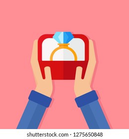 Happy valentine's day,Hands holds a jewelry box with a wedding ring with a big shining diamond