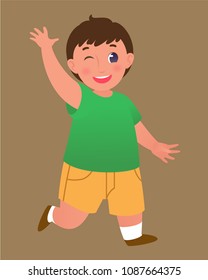 Happy winking baby boy in green t-shirt and yellow shorts. Isolated image.