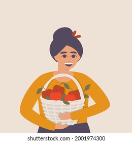 Happy woman with a basket of apples in her hands. Ripe apples in a basket. Fresh harvest of red apples. Autumn card with the harvest. Flat vector illustration.