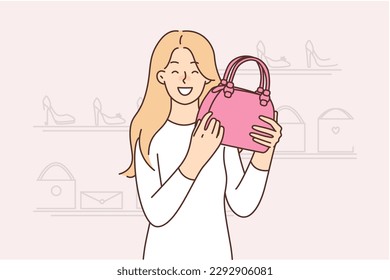 Happy woman chooses handbag standing in fashion store shopping in mall boutiques. Young girl with smile demonstrates purchased pink handbag from latest collection of fashion brand 