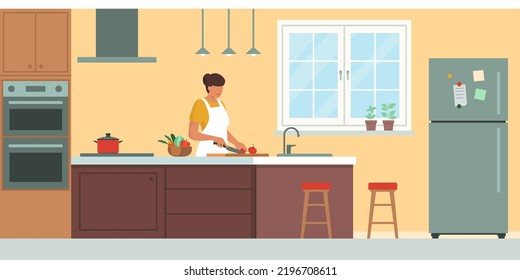 Happy woman cooking in the kitchen, domestic room interior