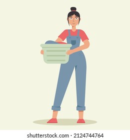 Happy Woman Doing Laundry. Woman Holding Backet With Clean Clothes. Housework, Laundry Service. Washing Clothes.