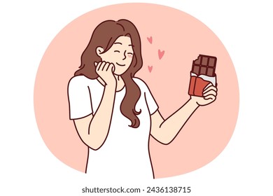 Happy woman enjoying taste of dark chocolate using sweet dessert for snacking and quickly removing hunger. concept of taking milk chocolate with sugar content to fight diabetes and increase insulin