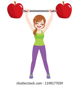 Happy woman exercising with apples dumbbell bar weight healthy diet concept. Sports training female athlete