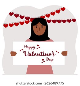 Happy woman holding a poster with text Happy Valentine's Day and red hearts. Love concept. Happy Valentine's Day wallpaper, poster, postcard or congratulation.