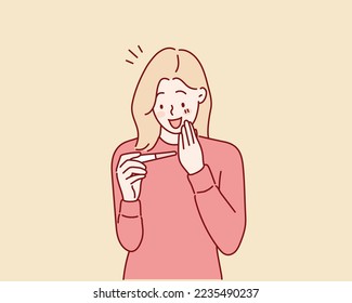 Mujer feliz con prueba de embarazo con dos marcas de línea como resultado positivo Ilustración de vectores de diseño plano. Ilustraciones de diseño vectorial de estilo dibujado a mano.