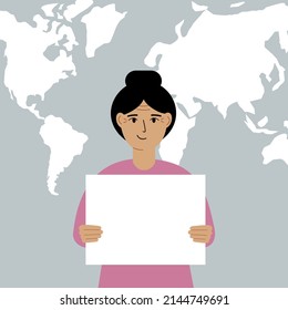 Happy woman holds and shows a white blank sheet, or a poster. Against the backdrop of the karate of the world.