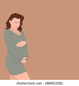 Happy woman hugs her pregnant belly.
