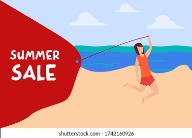 Happy woman jumping on the beach while pulling a Summer Sale banner