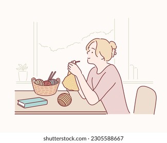  happy woman knits with knitted sweater in yellow color with threads of natural wool. Hand drawn style vector design illustrations.