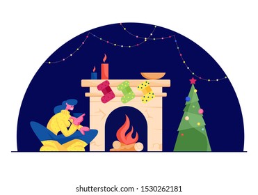 Happy Woman in Knitted Jumper Sitting with Cup of Tea at Fireplace with Hanging Socks for Gifts, Burning Logs and Candles in Decorated Room with Garland and Fir Tree. Cartoon Flat Vector Illustration