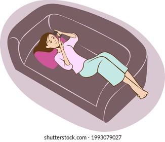 Happy woman lying on the couch and using smartphone.