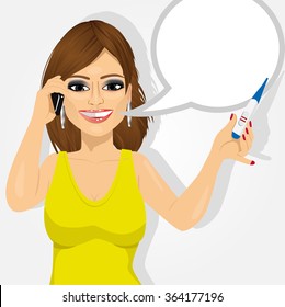 happy woman with positive pregnancy test talking on the smartphone