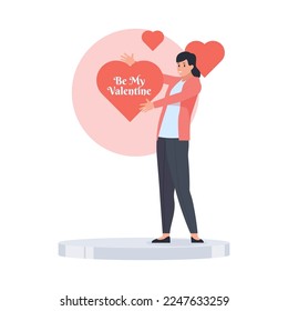 Happy woman present big heart that says be my valentine