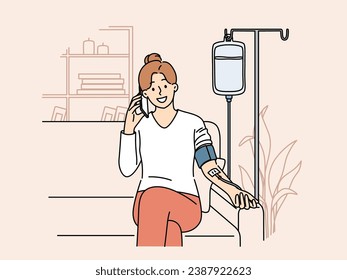 Happy woman receiving dropper with vitamins sitting on couch at home and talking to doctor on mobile phone. Girl with dropper for taking vitamins that improve immunity and health of body