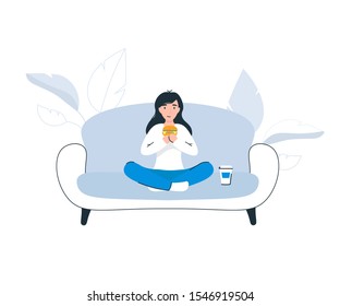 Happy woman sitting on couch eating hamburger and drinking soda at home. Flat modern vector cartoon illustration. isolated white background.