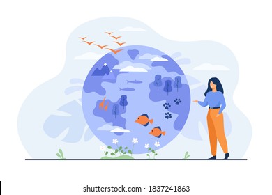 Happy woman standing and pointing on globe with flora and fauna diversity flat vector illustration. Earth habitats, ocean animals, plants and wildlife. Biodiversity, conservation and climate concept