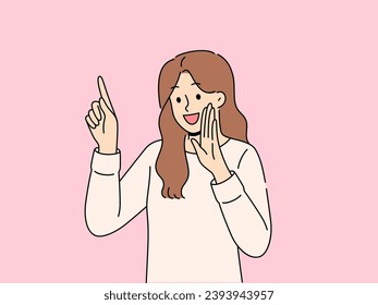 Happy woman tells secret by putting palm to mouth and pointing finger up to recommend paying attention to advertisement. Cheerful girl sharing secret by telling important information or life hacks