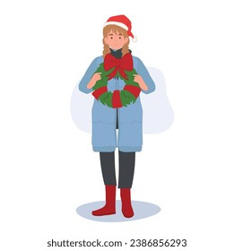 Happy Woman in Winter Costume with Christmas Wreath