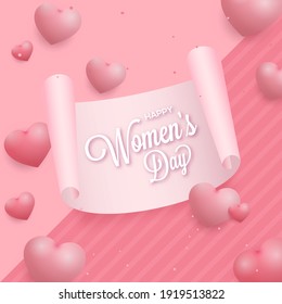 Happy Women's Day Font On Scroll Paper And Glossy Hearts Decorated Pink Background.