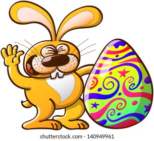 Happy yellow Easter bunny celebrating how beautifully decorated and big is his Easter Egg