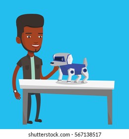 Happy young african-american man playing with a robotic dog. Smiling man standing near the table with a robotic dog on it. Man stroking a robotic dog. Vector flat design illustration. Square layout.