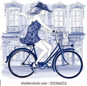 Happy young bicyclist riding in a street in Paris with a little dog - vector illustration