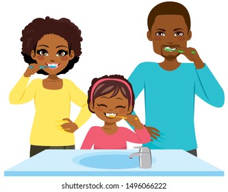 Happy young black family washing teeth together morning routine