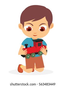 Happy Young Boy Playing His Red Toy Train