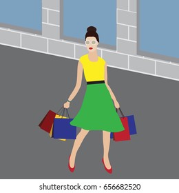 Happy young brunette woman with shopping bags having fun while shopping.