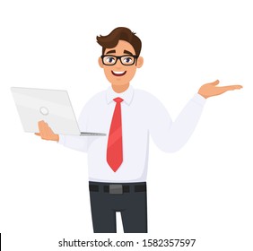 Happy young business man holding new brand laptop and presenting hand gesture to copy space. Person using latest computer and pointing to side. Male introducing something. Vector cartoon illustration.