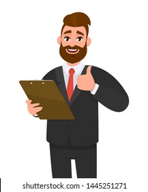 Happy young business man wearing a suit holding clipboard and making or showing thumbs up gesture or sign. Person keeping the file pad in hand. Male character design illustration. Modern lifestyle.