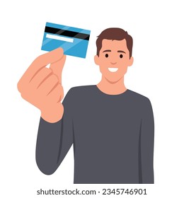 Feliz joven hombre de negocios mostrando crédito, débito, tarjeta de cajero automático. Hombre haciendo gesto de mano levantada. Ilustración de diseño de caracteres masculinos. Emociones humanas, expresiones faciales. Vector plano 